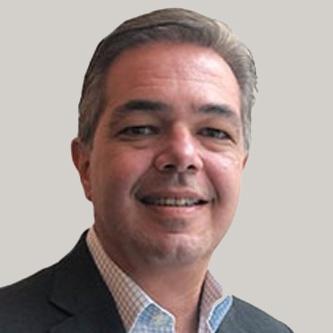 Hamilton Reserve Bank employee smiling in professional attire